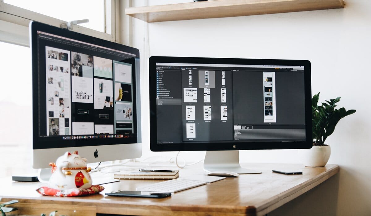 Two Apple Monitor Displaying Images