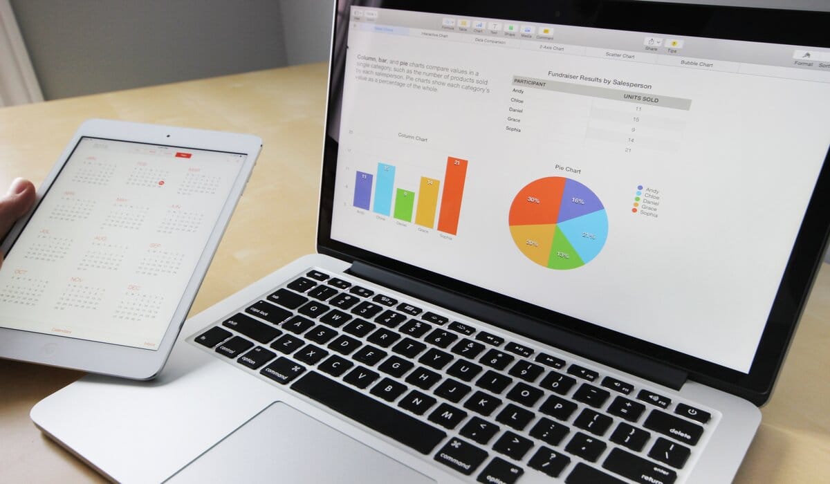 Laptop Showing Data And Tablet Showing Calender