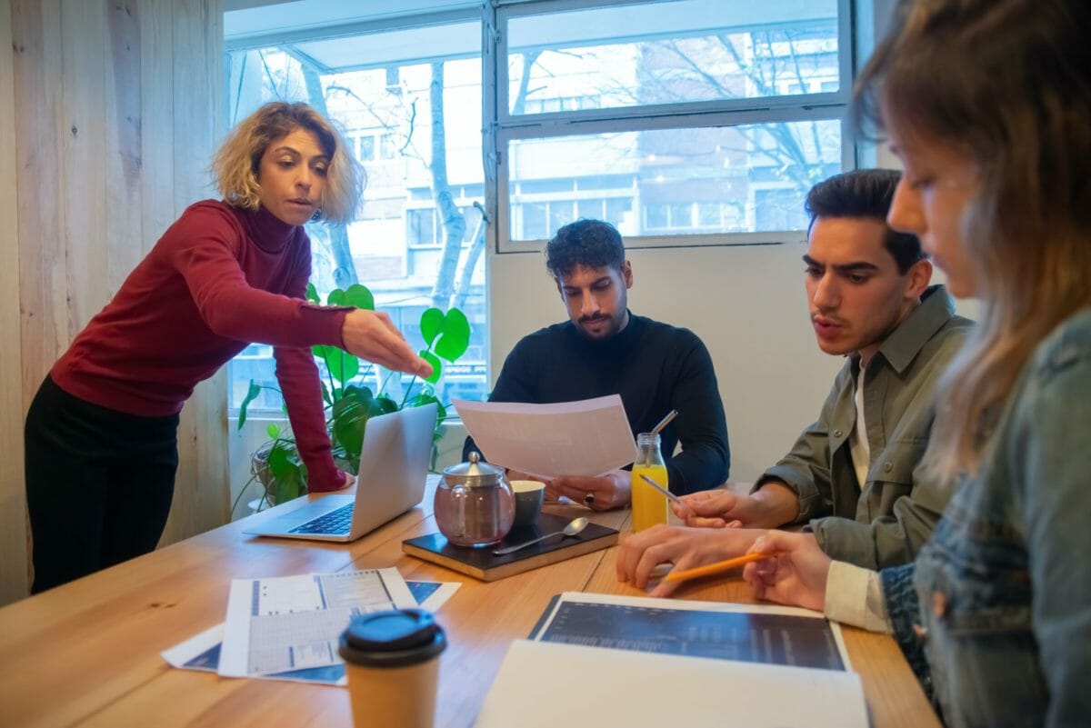 People In A Group With A Laptop
